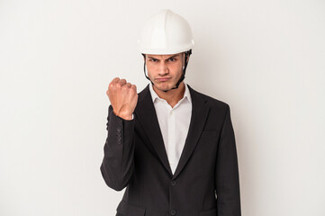 Young architect caucasian man isolated on white background showing fist to camera, aggressive facial expression.