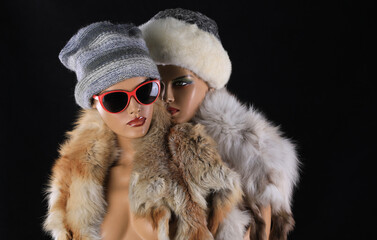 two female mannequins in fur clothes