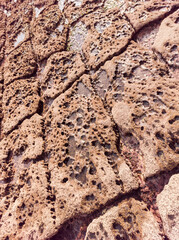 Close-up of The texture of the Natural stone background, sandy rocks on the coast of Donegal, Ireland.