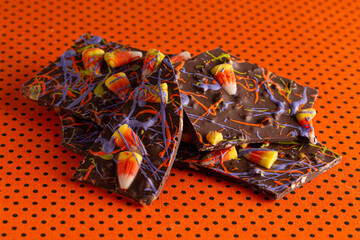 Broken  Chocolate Halloween Bark on an Orange and Black Tablecloth
