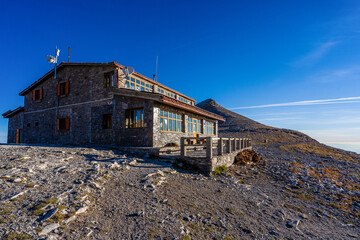 Fototapeta na wymiar Refuge in the greek mountains made of stone with blue sky in the background