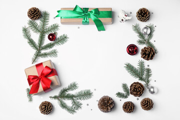 Christmas greeting card with space for text. Flat lay composition of fir tree branches and festive decor on white background