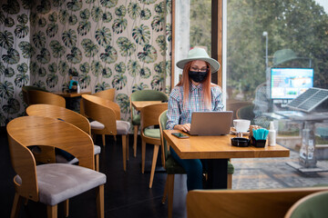 Portrait of young woman at caffe break.Work from home.