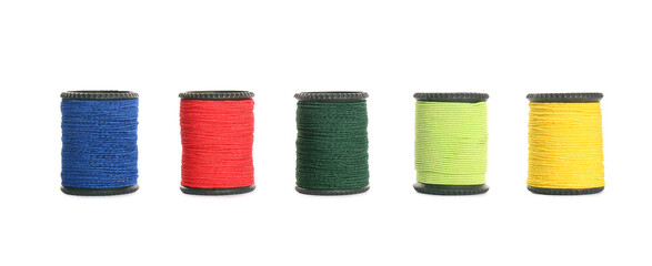 Set of colorful sewing threads on white background