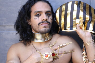 Traditional egyptian man with golden jewelry  