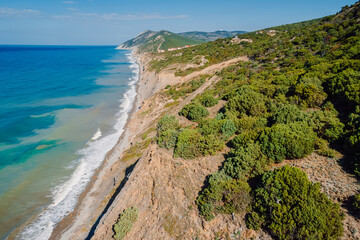 Ocean coastline with waves and highest cliff on coastline. Aerial view