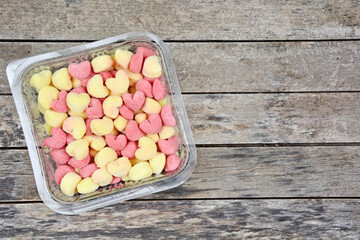 Colorful gnocchi in a plastic receipe