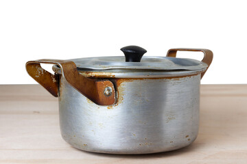 Old aluminum saucepan with  lid
