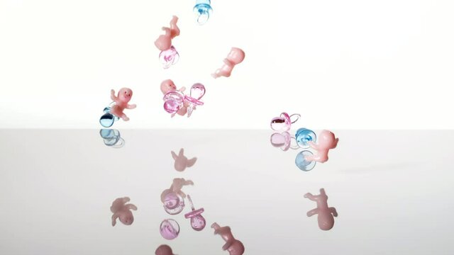 Falling babies and dummies pouring, white background. Baby shower and population