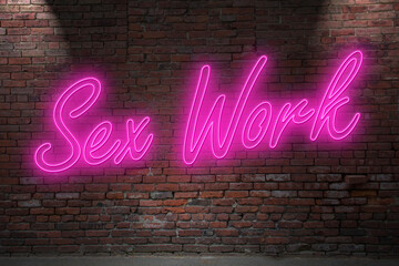Neon Sex worker (in german Sexarbeiter also Sexarbeiterin) lettering on Brick Wall at night