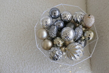 basket with shiny Christmas decorations