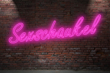 Neon Bondage Sex Swing (in german Sexschaukel) lettering on Brick Wall at night