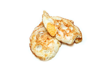 Two fried egg isolated in a white background.  