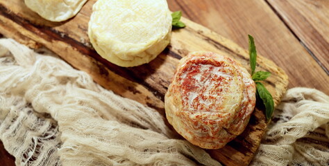 round shape goat cheese closeup selective focus, farm cheeses.