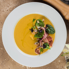 Pumpkin cream soup. Top view. Flat lay