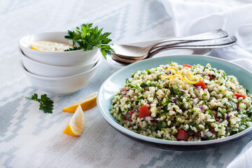 Tabbouleh salad. Traditional middle eastern or arab vegetarian salad with bulgur, parsley, mint and tomato.
