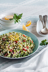 Tabbouleh salad. Traditional middle eastern or arab vegetarian salad with bulgur, parsley, mint and tomato.