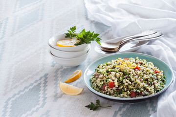 Tabbouleh salad. Traditional middle eastern or arab vegetarian salad with bulgur, parsley, mint and tomato.