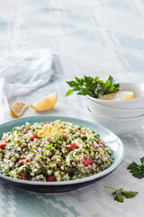 Tabbouleh salad. Traditional middle eastern or arab vegetarian salad with bulgur, parsley, mint and tomato.