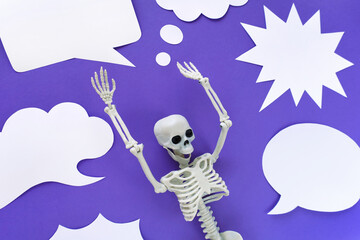 Skeleton on violet background with lots of white blank paper speech bubbles. Anatomical plastic...