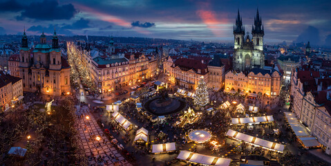 Panoramic view to the old town square of Prague with the famous Christmas Market and festive lights during a cold winter evening - obrazy, fototapety, plakaty