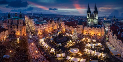 Papier Peint photo autocollant Prague Panoramic view to the old town square of Prague with the famous Christmas Market and festive lights during a cold winter evening