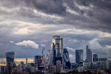 Skyline of the City of London with grey clouds during stormy autumn season