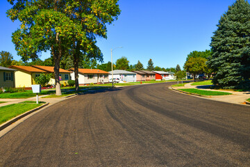 Modern homes line the streets of this comfortable clean neighborhood in growing Bismarck, North Dakota.