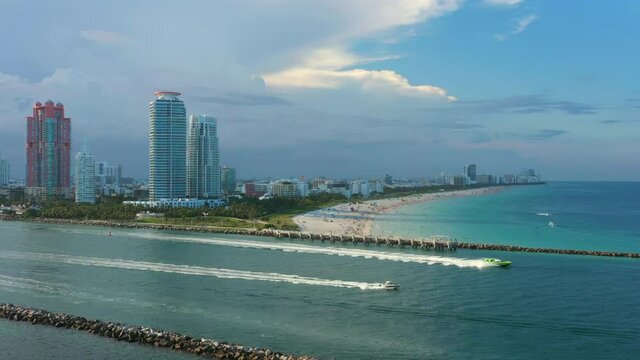 Boats speed along the southern coast of Miami Beach