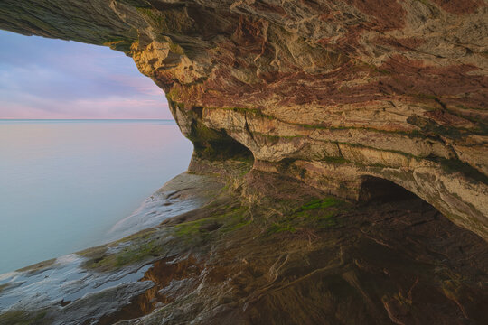 Landscape near sunset of the interior of a sea cave, Paradise Point, Lake Superior, Michigan’s Upper Peninsula, USA