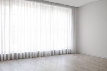 Light curtains on big window in empty room - obrazy, fototapety, plakaty
