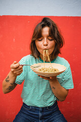 young woman eating pasta cute girl eating spaghetti having fun delicious food photography
