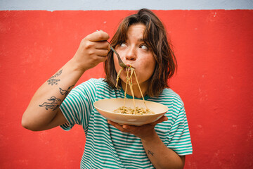 young woman eating pasta cute girl eating spaghetti having fun delicious food photography