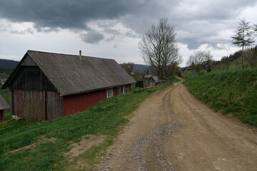 Fototapeta na wymiar Wooden house in the mountain village in Carpathians, Ukraine