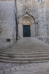 Fototapeta na wymiar 15th century Saint Sebastian church was built by Ploce gate, for a good reason: St Sebastian is the saint protector against plague. Dubrovnik, Croatia.