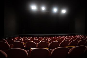 theater seats and stage with floodlights