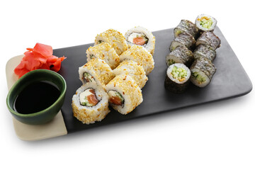 Delicious sushi rolls on white background
