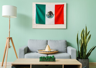 Interior of stylish living room with Mexican flag