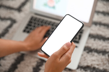 Female hand with modern mobile phone, closeup