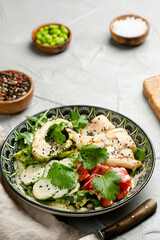 avacado salad with grilled and fresh vegetables closeup with copy space