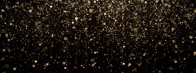 Gold glitter texture on black. Shinny small particles reflecting light. - obrazy, fototapety, plakaty