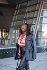Obraz premium Pretty young mixed race african american, hipster vlogger woman with afro hair in lyon city