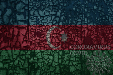 flag of azerbaijan on a old metal rusty cracked wall with text coronavirus, covid, and virus picture.