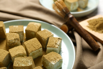 Plate with tasty hojicha marshmallows on table, closeup