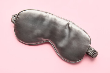 Stylish sleep mask on color background