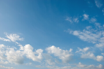 Blue sky background with tiny clouds.