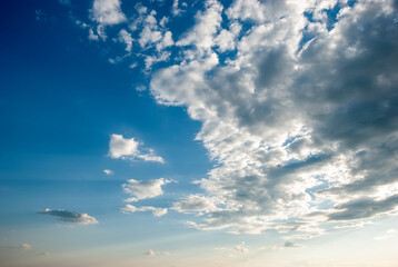 Blue sky background with tiny clouds.
