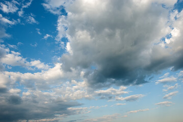 Blue sky background with tiny clouds.