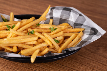 portion of french fries with salt and parsley