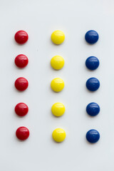 colored magnets with round shape, on white background